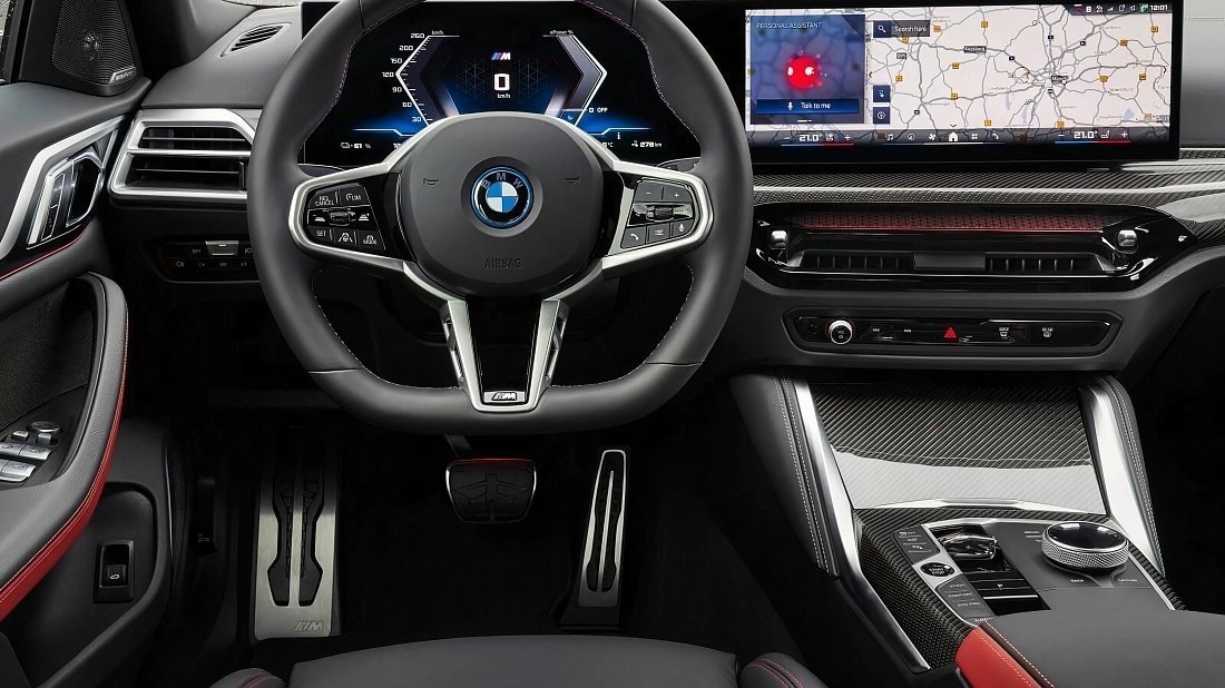BMW i4 eDrive35 (2024-…) интерьер, переднее сиденье, водительское сиденье, приборная панель, рулевое колесо, информационно-развлекательная система, кокпит