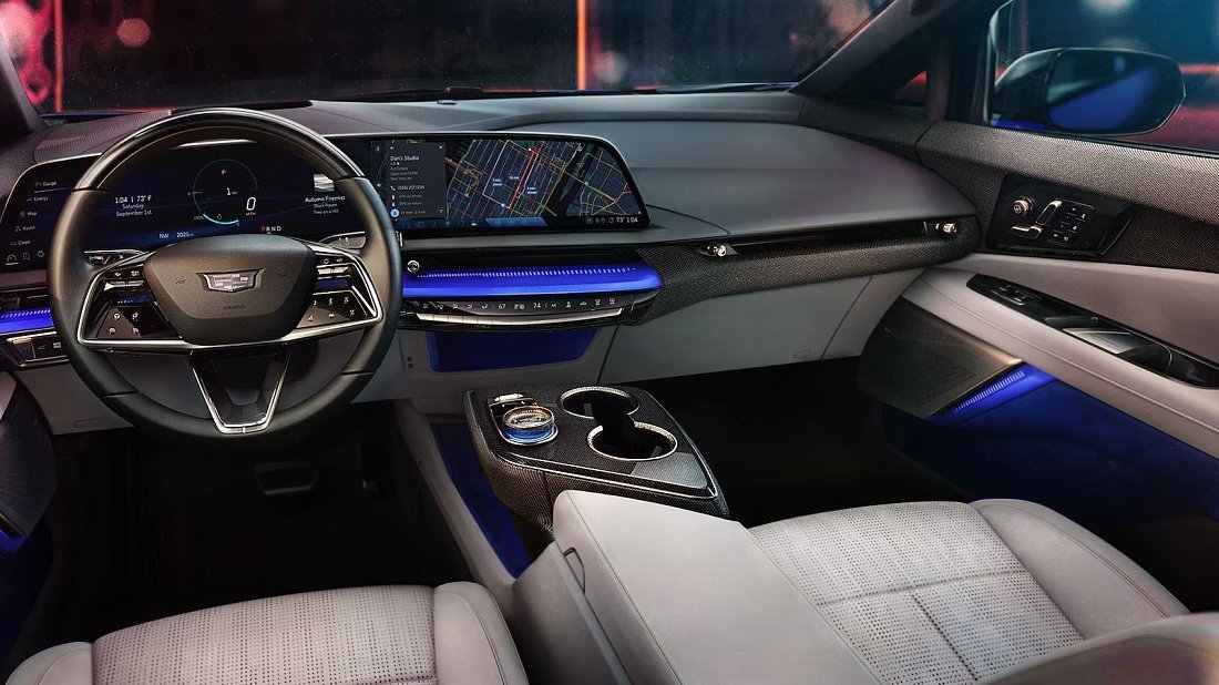 Cadillac Optiq AWD (2024-…) интерьер, переднее сиденье, водительское сиденье, приборная панель, рулевое колесо, информационно-развлекательная система, кокпит