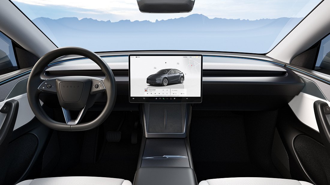 Tesla Model Y Long Range RWD (2025-...) интерьер, переднее сиденье, водительское сиденье, приборная панель, рулевое колесо, информационно-развлекательная система, кокпит